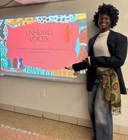 HU Annenberg Honors Student in front of projection screen